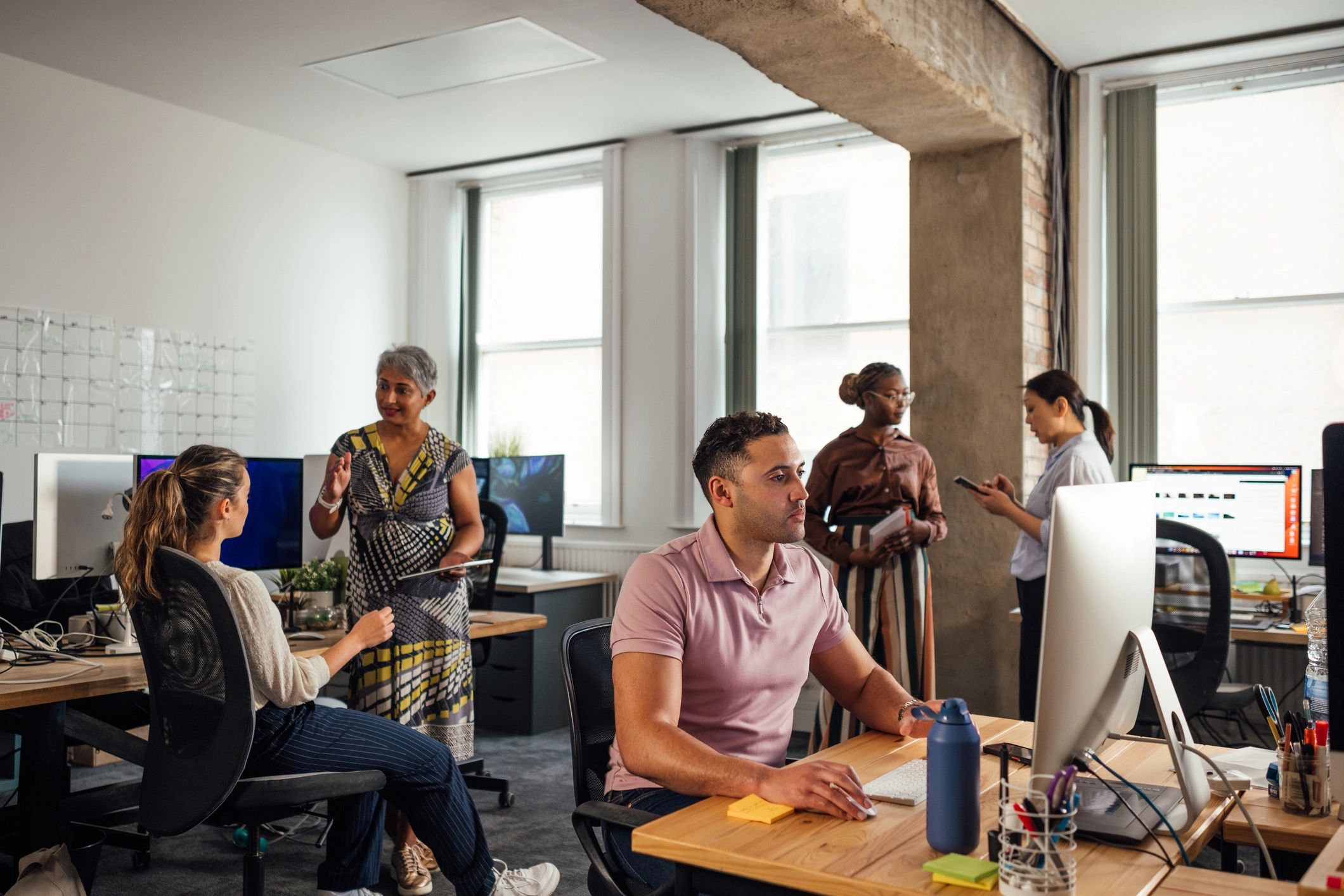 IT consulting team collaborating in a modern office